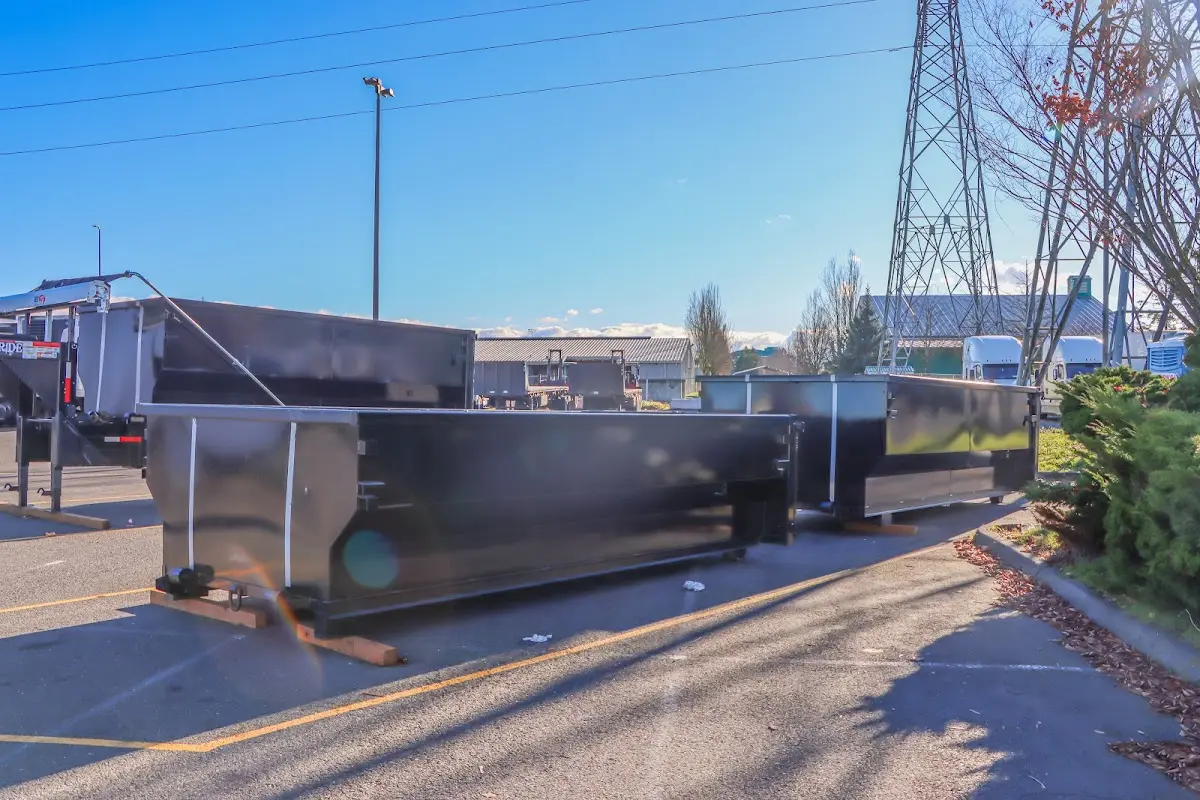 Roll-off dumpster ready for waste disposal at job site for Concrete Dumpster Rental in Kaser